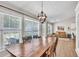 Well-lit dining area with large windows, hardwood floors, and convenient access to the kitchen at 2780 Matlin Way, Buford, GA 30519