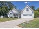 Charming two-story home with well-manicured lawn, attached garage, and inviting front porch at 2780 Matlin Way, Buford, GA 30519