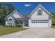 Charming two-story home with well-manicured lawn, attached garage, and inviting front porch at 2780 Matlin Way, Buford, GA 30519