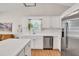 Well-lit kitchen with white cabinetry, stainless steel appliances, and a functional layout perfect for cooking at 2780 Matlin Way, Buford, GA 30519