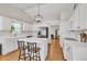 Bright, modern kitchen features white cabinets, stainless steel appliances, and a stylish island with seating at 2780 Matlin Way, Buford, GA 30519