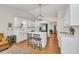 Bright kitchen featuring white cabinetry, a central island with seating, and stainless steel appliances at 2780 Matlin Way, Buford, GA 30519