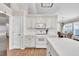 Charming kitchen with white appliances, ample cabinet space, and a view towards the dining area at 2780 Matlin Way, Buford, GA 30519