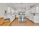 Bright kitchen featuring white cabinetry, a central island with seating, and stainless steel appliances at 2780 Matlin Way, Buford, GA 30519