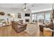 Bright living room features hardwood floors, a fireplace, and an open view into the dining area at 2780 Matlin Way, Buford, GA 30519