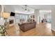 Spacious living room with hardwood floors, fireplace, and large windows for natural light at 2780 Matlin Way, Buford, GA 30519