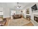 Cozy living room with fireplace, hardwood floors, and neutral color scheme at 2780 Matlin Way, Buford, GA 30519