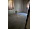 Unfinished basement featuring painted block walls, concrete flooring, and natural light from two windows at 309 E Rhinehill E Rd, Atlanta, GA 30315