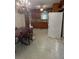 Kitchen with dining table, wood cabinets, chandelier and modern fridge at 309 E Rhinehill E Rd, Atlanta, GA 30315