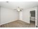 Bedroom showing neutral walls and access to the hallway at 6073 Camden Forrest Dr, Riverdale, GA 30296