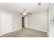 Carpeted bedroom with two white doors and a window at 6073 Camden Forrest Dr, Riverdale, GA 30296