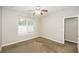 Comfortable bedroom with plush carpeting, and ample natural light at 6073 Camden Forrest Dr, Riverdale, GA 30296