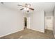 This bedroom features neutral paint, carpet, and ceiling fan at 6073 Camden Forrest Dr, Riverdale, GA 30296