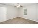 Bedroom with neutral walls, carpet, door, and one window at 6073 Camden Forrest Dr, Riverdale, GA 30296