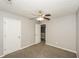 Bedroom with neutral walls, carpet, and two doors at 6073 Camden Forrest Dr, Riverdale, GA 30296