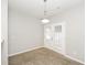 Dining area with modern lighting and access to outdoor space at 6073 Camden Forrest Dr, Riverdale, GA 30296