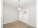 Cozy dining area features a modern light fixture and French doors at 6073 Camden Forrest Dr, Riverdale, GA 30296