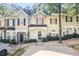 Charming townhome with manicured landscaping, neutral paint, and a welcoming entrance at 6073 Camden Forrest Dr, Riverdale, GA 30296