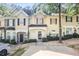 Charming townhome with welcoming facade and well-maintained landscaping at 6073 Camden Forrest Dr, Riverdale, GA 30296