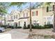 Inviting townhome exterior with attractive architectural details and manicured grounds at 6073 Camden Forrest Dr, Riverdale, GA 30296