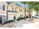 Lovely townhome featuring a cozy entrance and beautifully landscaped front yard at 6073 Camden Forrest Dr, Riverdale, GA 30296