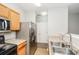 Functional kitchen with stainless appliances and sleek countertops at 6073 Camden Forrest Dr, Riverdale, GA 30296