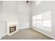 Cozy living space featuring a fireplace and large windows, offering natural light at 6073 Camden Forrest Dr, Riverdale, GA 30296