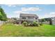 Large backyard with a lush lawn and mature trees, offering plenty of space for outdoor activities at 776 Amos Ln, Kennesaw, GA 30152