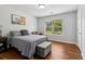 Inviting bedroom with natural light, comfortable furnishings, and a serene atmosphere for relaxation at 776 Amos Ln, Kennesaw, GA 30152