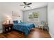 Calm bedroom featuring hardwood floors, a ceiling fan, and bright blue bedding at 776 Amos Ln, Kennesaw, GA 30152