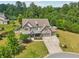 Beautiful two-story home with stone and siding, well-manicured lawn, and a three-car garage at 776 Amos Ln, Kennesaw, GA 30152