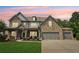 Charming two-story home with a stone facade, covered porch and a spacious three-car garage at 776 Amos Ln, Kennesaw, GA 30152