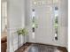 Bright foyer featuring a white front door, a window, and an accent table with a plant at 776 Amos Ln, Kennesaw, GA 30152