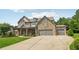 Charming two-story home with stone accents, a welcoming front porch, and a three-car garage at 776 Amos Ln, Kennesaw, GA 30152