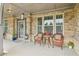 Charming front porch featuring stone accents, seating, and a welcoming entrance at 776 Amos Ln, Kennesaw, GA 30152