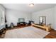 Open workout space with hardwood floors, exercise equipment, TV and large rug at 776 Amos Ln, Kennesaw, GA 30152