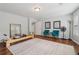 Spacious gym featuring wood floors, large rug, and fitness equipment at 776 Amos Ln, Kennesaw, GA 30152