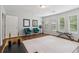 Spacious gym area with wood floors, large rug, and natural light; ideal for fitness enthusiasts at 776 Amos Ln, Kennesaw, GA 30152