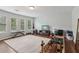 Bright gym area with wood floors, large rug, and natural light; perfect for working out at 776 Amos Ln, Kennesaw, GA 30152