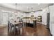 Bright kitchen featuring white cabinetry, stainless steel appliances, granite countertops and an island with seating at 776 Amos Ln, Kennesaw, GA 30152