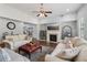 Cozy living room with hardwood floors, fireplace, television, and comfortable seating; perfect for relaxation and entertainment at 776 Amos Ln, Kennesaw, GA 30152