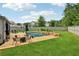 Inviting backyard pool and patio area with plenty of seating, perfect for relaxing and entertaining outdoors at 776 Amos Ln, Kennesaw, GA 30152