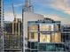 Modern luxury high-rise building featuring unique architectural design with balconies and city views at 860 Peachtree Ne St # 2801, Atlanta, GA 30308