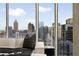 Breathtaking city view from the living area, featuring floor-to-ceiling windows at 860 Peachtree Ne St # 2801, Atlanta, GA 30308