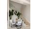 Cozy dining area with modern furniture and a staircase featuring glass railings and illuminated steps at 860 Peachtree Ne St # 2801, Atlanta, GA 30308