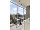 Small dining area with city views, white accents, and floor to ceiling windows at 860 Peachtree Ne St # 2801, Atlanta, GA 30308
