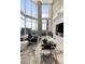 Bright living room with large windows and comfortable seating, highlighting the cityscape views at 860 Peachtree Ne St # 2801, Atlanta, GA 30308