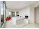 Bright main bedroom with city views from floor to ceiling windows and modern decor at 860 Peachtree Ne St # 2801, Atlanta, GA 30308
