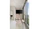 Modern main bedroom featuring large windows with city views, and sleek built-in shelves and decor at 860 Peachtree Ne St # 2801, Atlanta, GA 30308