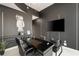 Contemporary office space featuring modern black decor, a large television, and unique wall art at 860 Peachtree Ne St # 2801, Atlanta, GA 30308